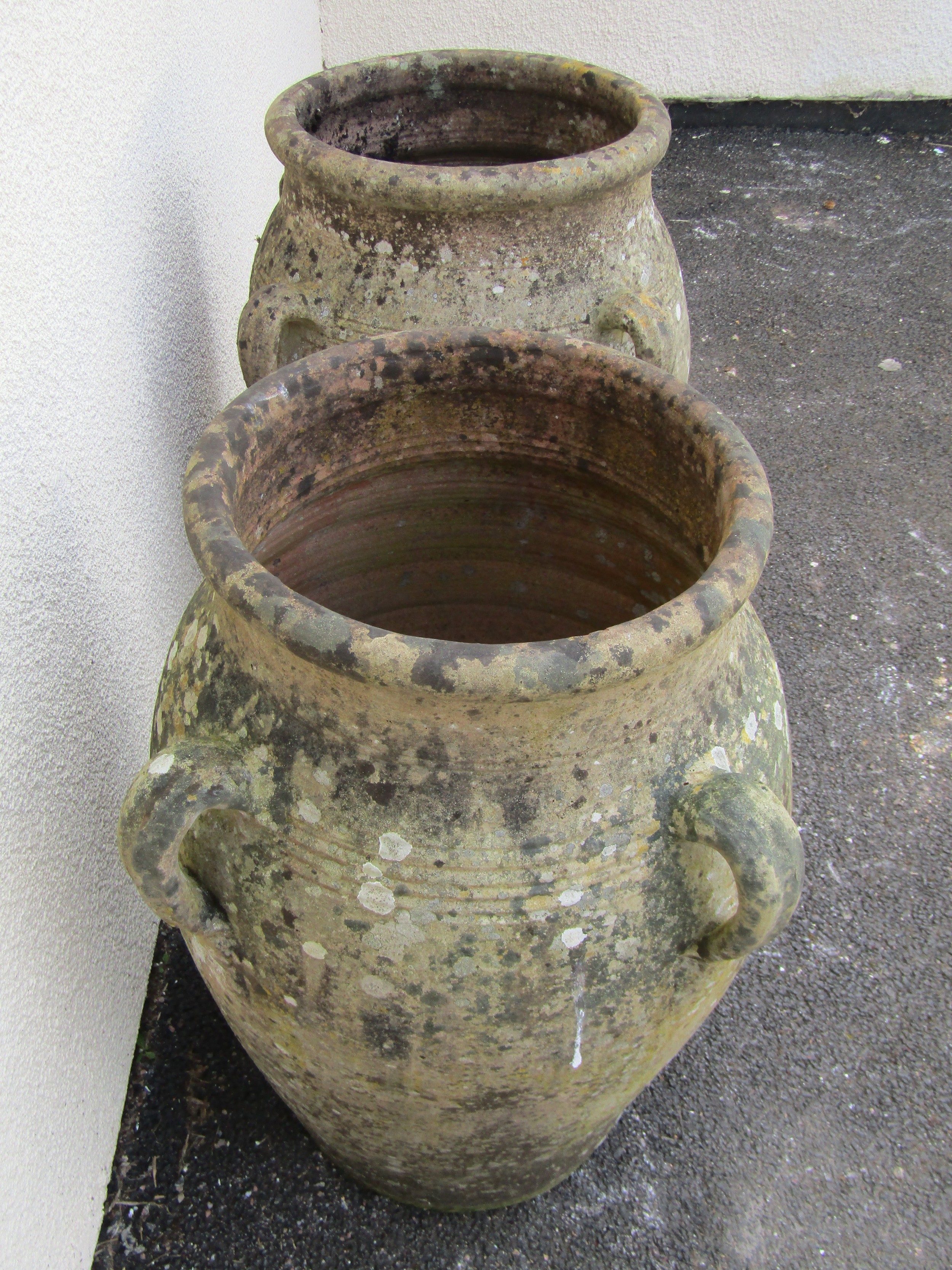 A large pair of weathered terracotta planters of tapering baluster form, each fitted with four - Image 3 of 5