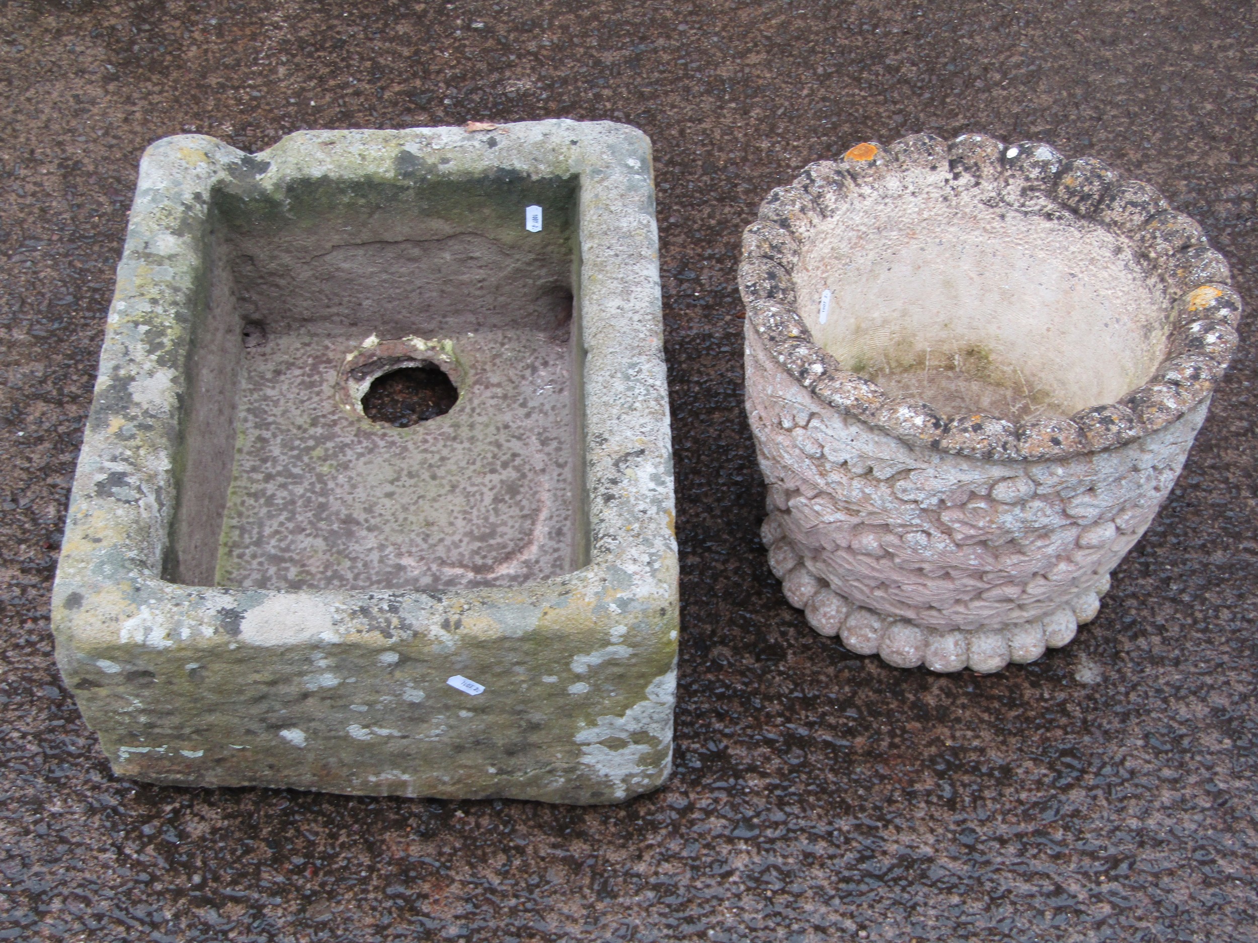 A weathered rectangular natural stone trough with single channel and two drainage holes, 22 cm