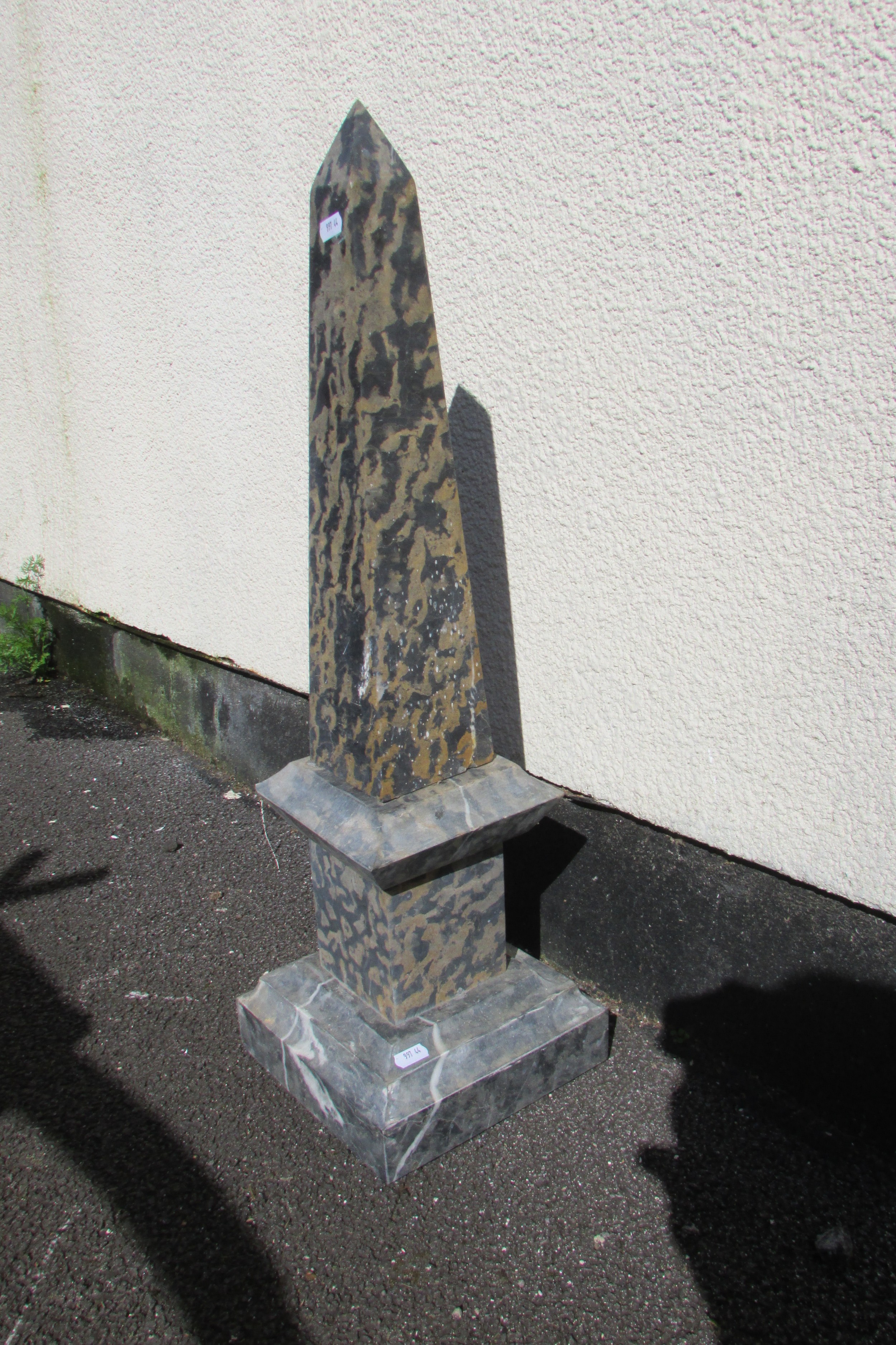 An antique Grand Tour type cut and polished marble obelisk on plinth base, 70cm high, the base