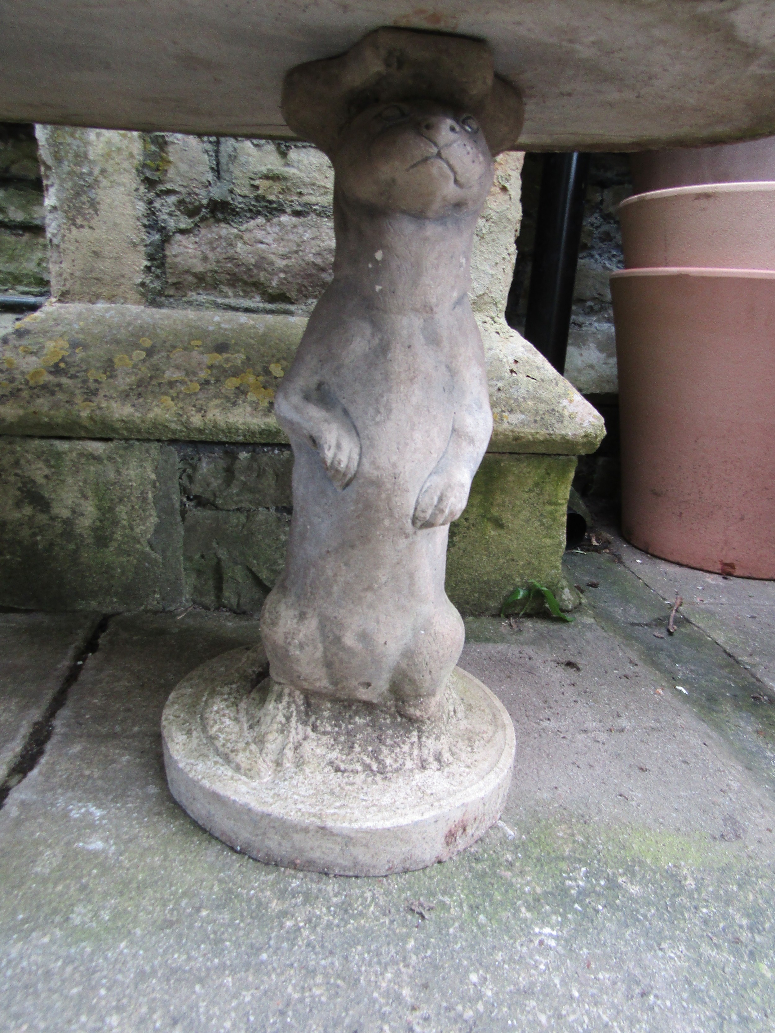 A novelty weathered three sectional composition stone garden table with oval top on standing otter - Image 2 of 4