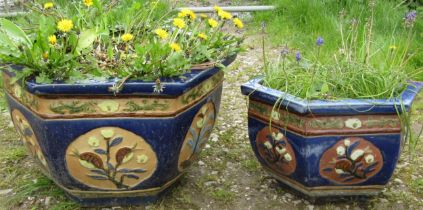 A predominantly blue glazed hexagonal Chinese style glazed planter with foliate relief panels 37