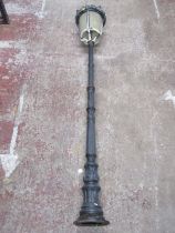 A Victorian style cast iron and alloy street lamp post with tapered cylindrical lantern, approx