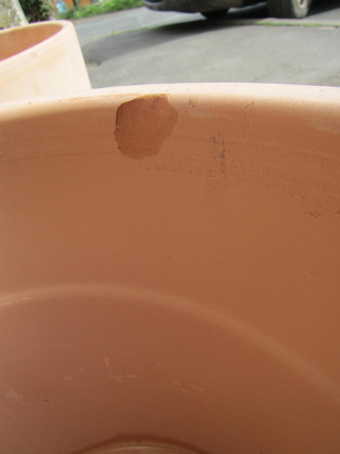 A pair of contemporary terracotta planters of circular tapered form with wide collars, 39m high x - Image 4 of 4