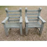A pair of Woodfern heavy gauge painted and weathered teak garden open armchairs with slatted seats