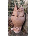 A salt glazed figure of an owl with pierced and incised detail, 55 cm high