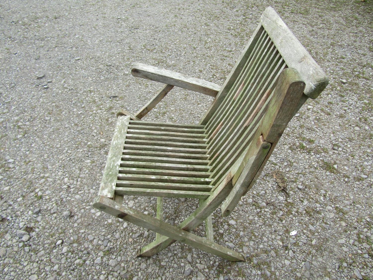 An associated weathered contemporary teak garden suite comprising table with oval slatted panelled - Image 5 of 7