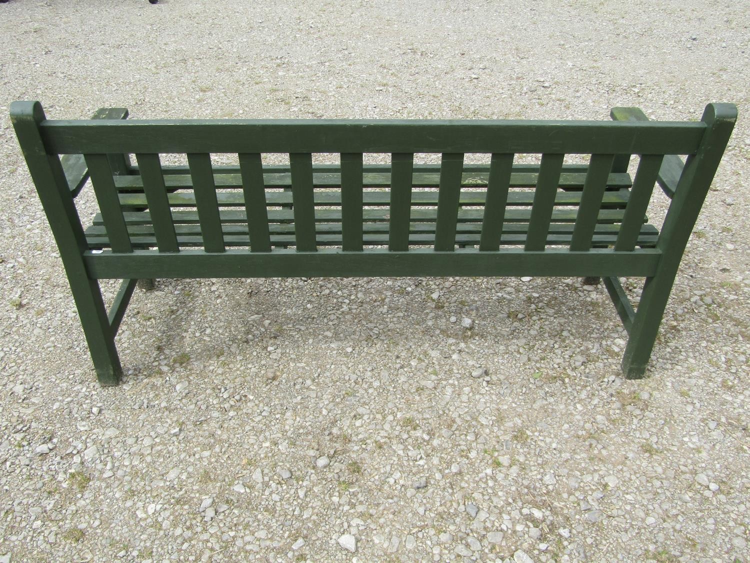A vintage green painted teak three seat garden bench with slatted seat and back (probably a Lister - Image 4 of 5