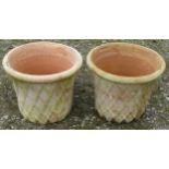 A pair of contemporary terracotta planters in the form of lattice baskets, 32 cm high x 40 cm