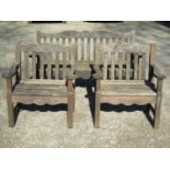 A Bridgman & Co Ltd stained and weathered teak three seat garden bench 161 cm wide and a pair of