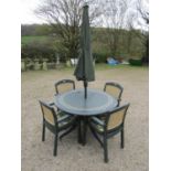 A moulded plastic patio set by Hartman consisting of a circular top table, 120 cm diameter raised on