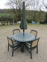 A moulded plastic patio set by Hartman consisting of a circular top table, 120 cm diameter raised on