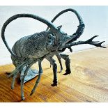A decorative Japanese weathered cast metal model of a lobster, 22cm high, 30cm long