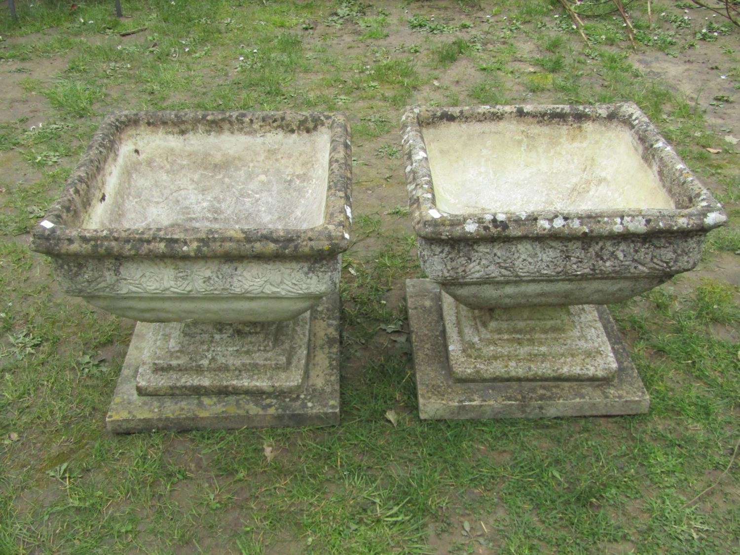A pair of weathered cast composition stone garden urns of squat square cut and tapered form with - Image 3 of 4