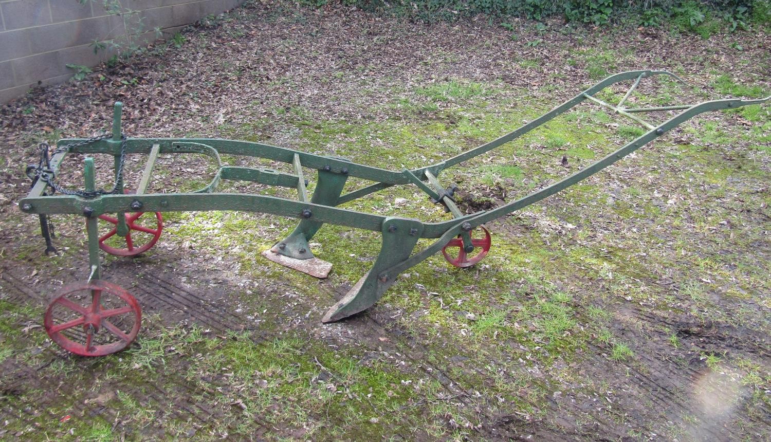 A three wheeled walk behind horse drawn plough 295 cm long