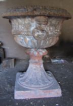 19th century terracotta urn of classical form with fluted detail, mask and ring handle - old repairs