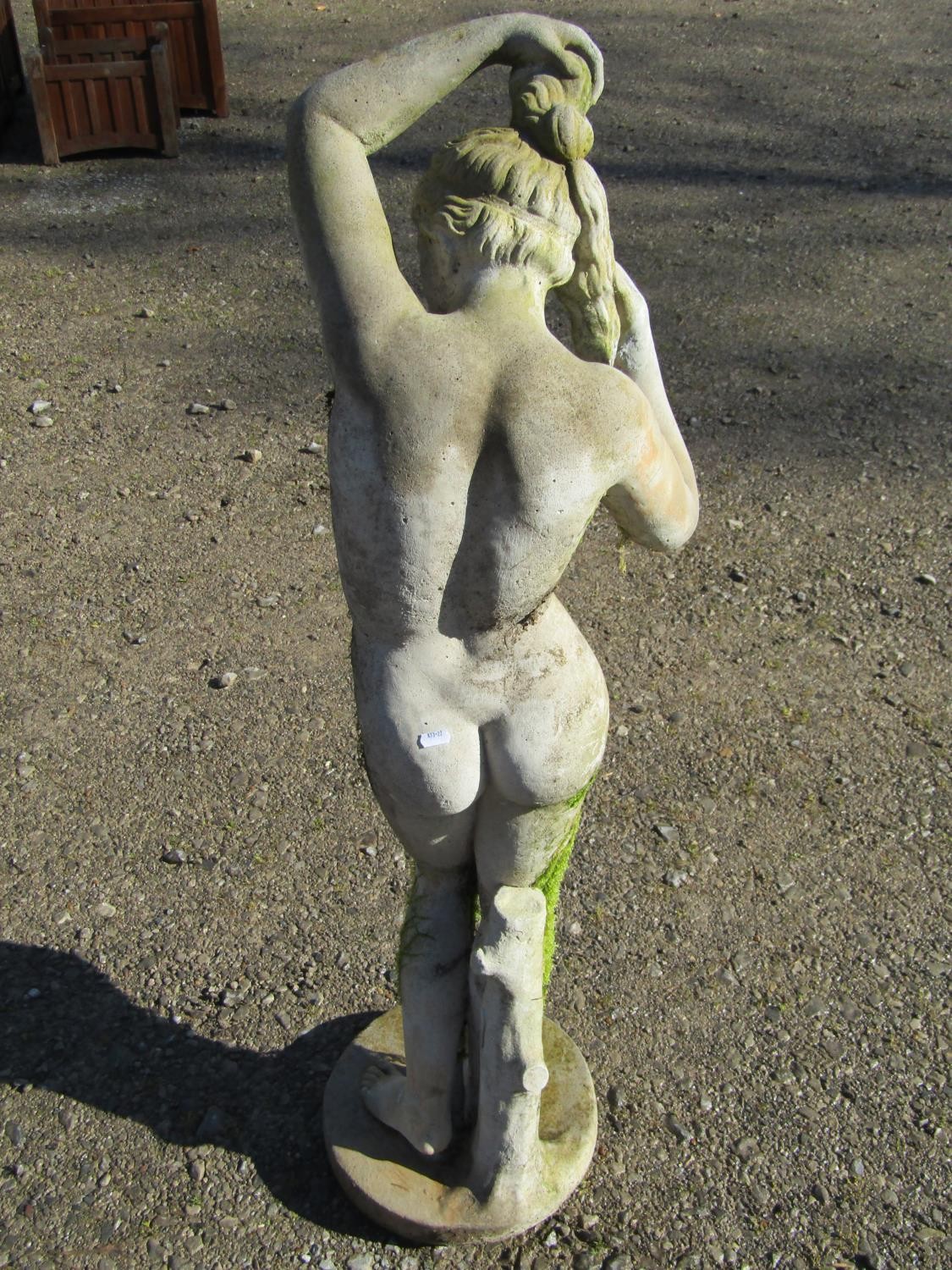 A weathered cast composition stone garden ornament in the form of a standing classical female nude - Image 3 of 7