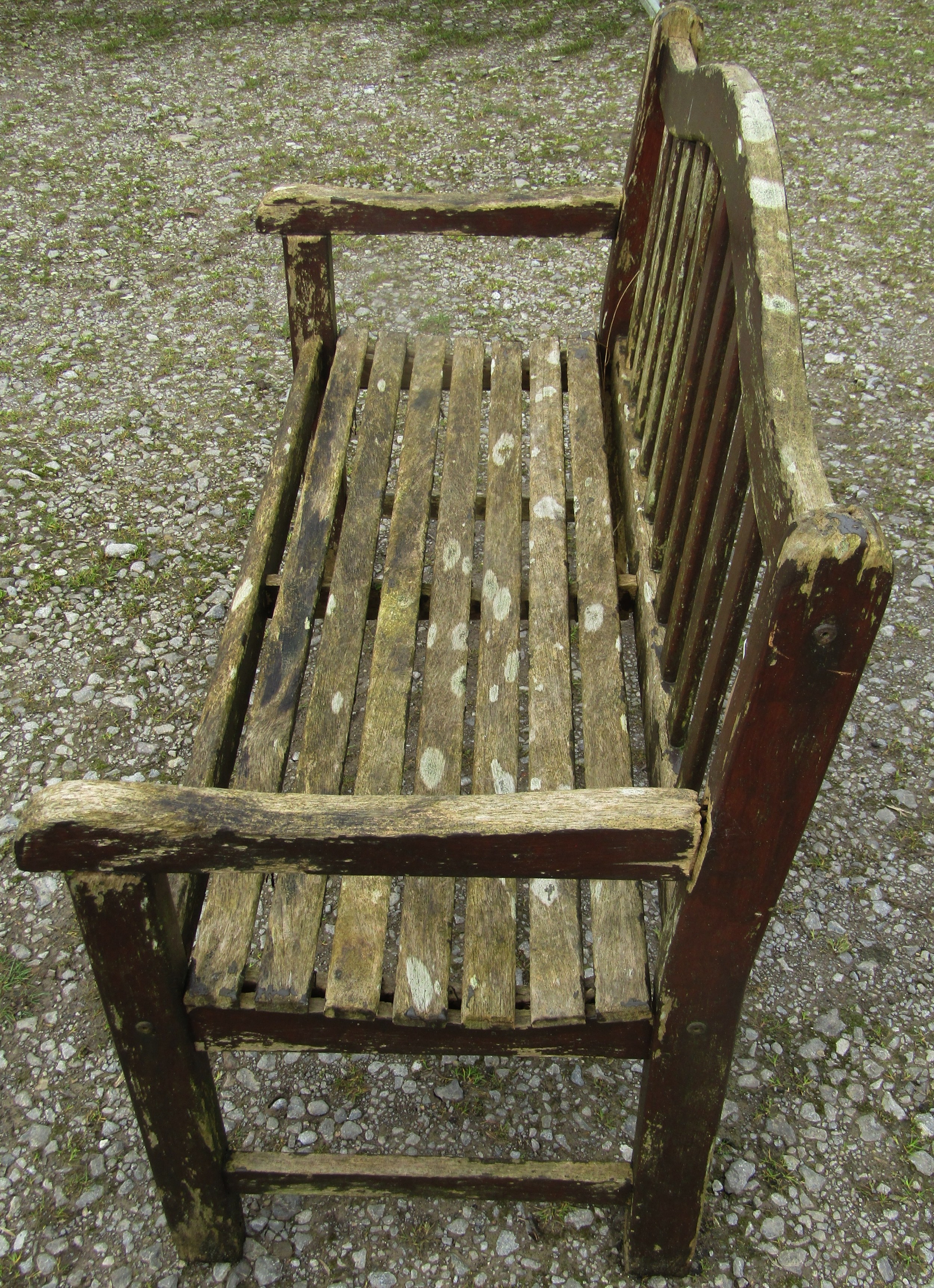 A weathered and stained teak garden bench with slatted seat and back beneath an arched rail, 120 cm, - Image 2 of 5