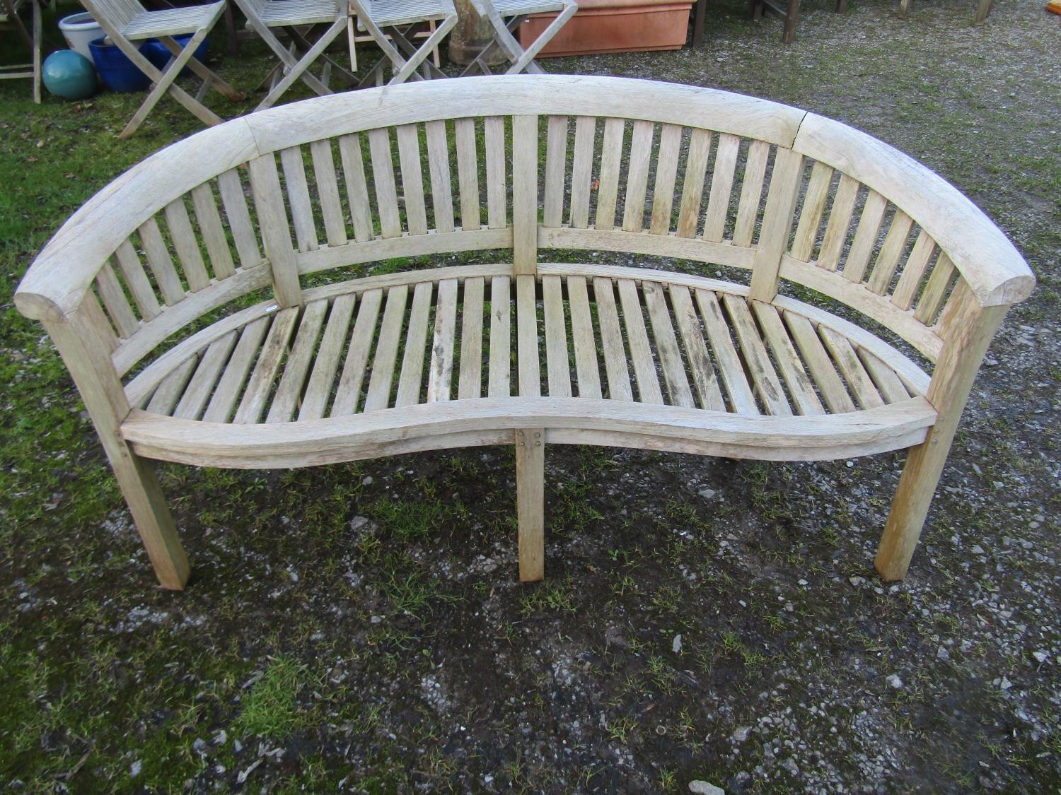 A pair of weathered teak banana shaped garden benches 160 cm wide - Image 5 of 7