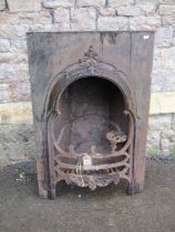 A 19th century cast iron fire insert with gothic tracery detail, 92 cm high x 61 cm wide
