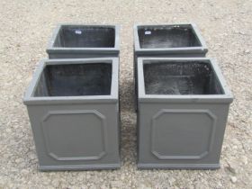 Four moulded fibre glass to simulate lead square cut planters with repeating panels 27 cm square