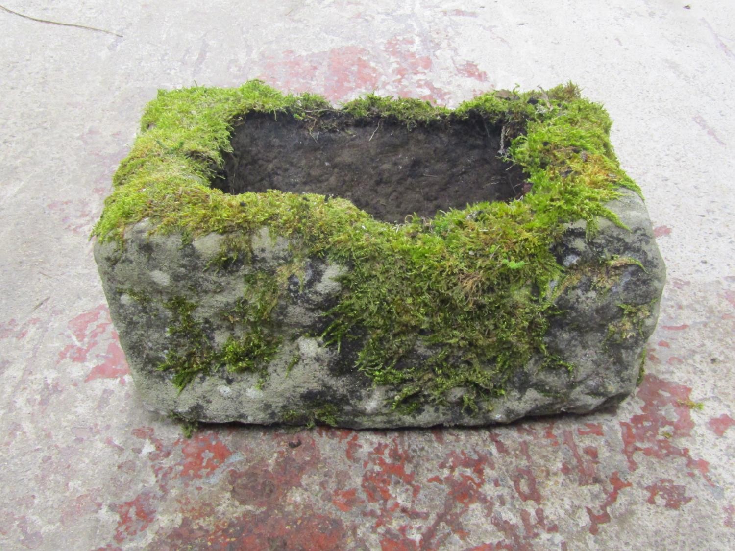 A small shallow but thick walled rectangular natural stone trough, 20cm high x 48cm x 30cm