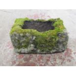 A small shallow but thick walled rectangular natural stone trough, 20cm high x 48cm x 30cm