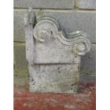 A carved natural stone corbel with scroll detail 40 cm high x 53 cm x 24 cm