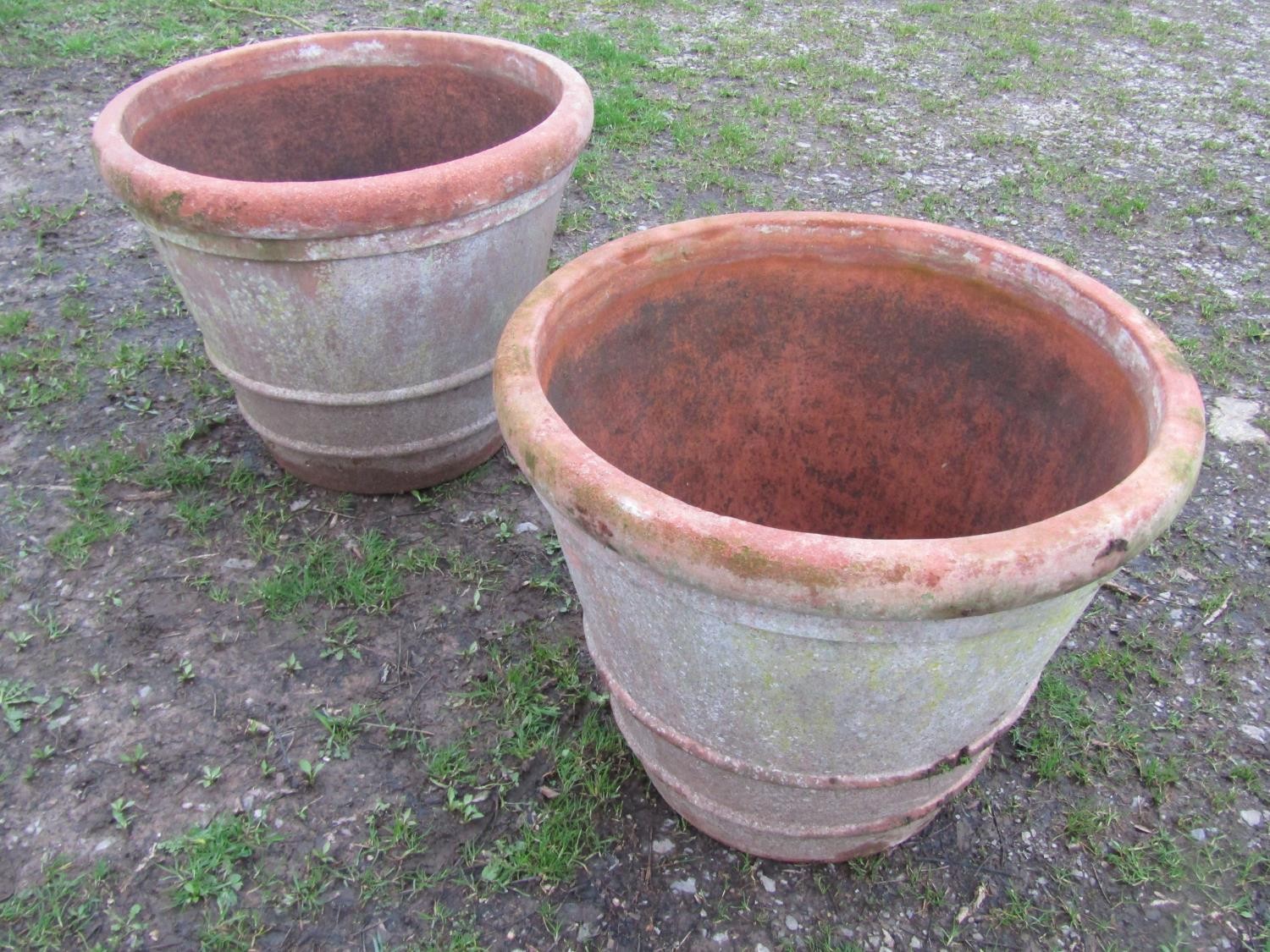 A pair of large weathered terracotta planters of circular tapered and simple ribbed form, 56 cm high - Image 2 of 6