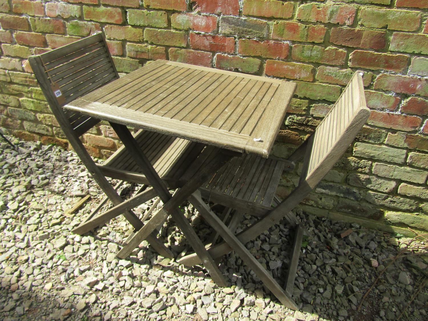 A contemporary wooden three piece folding terrace set with square slatted top table, and a pair of - Image 3 of 3