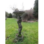A weathered reconstituted bird bath, the column in the form of a boy, arms aloft, old repairs, 95 cm