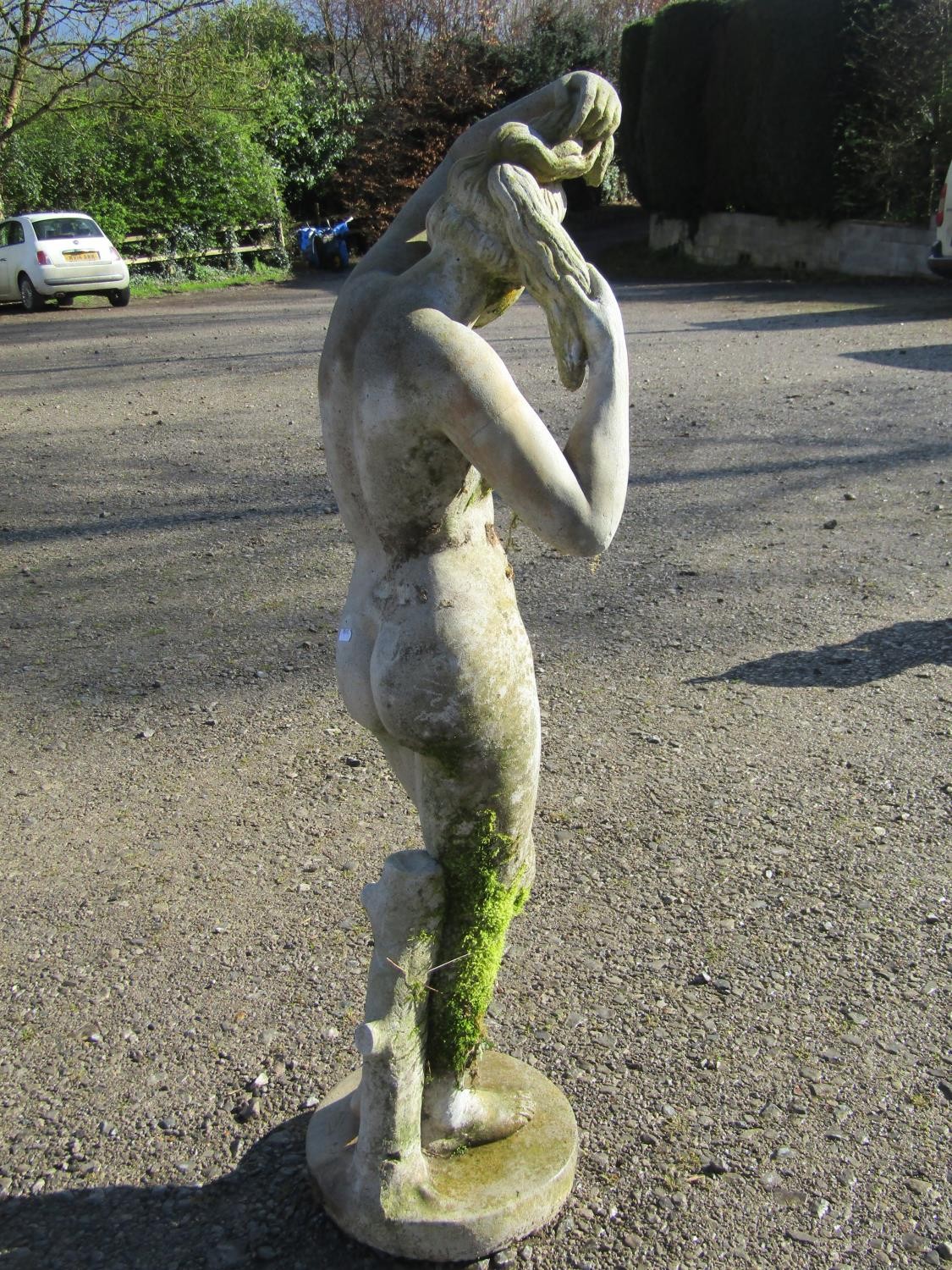 A weathered cast composition stone garden ornament in the form of a standing classical female nude - Image 4 of 7