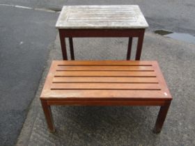 A vintage stained and weathered Lister burma teak garden table of rectangular form with slatted