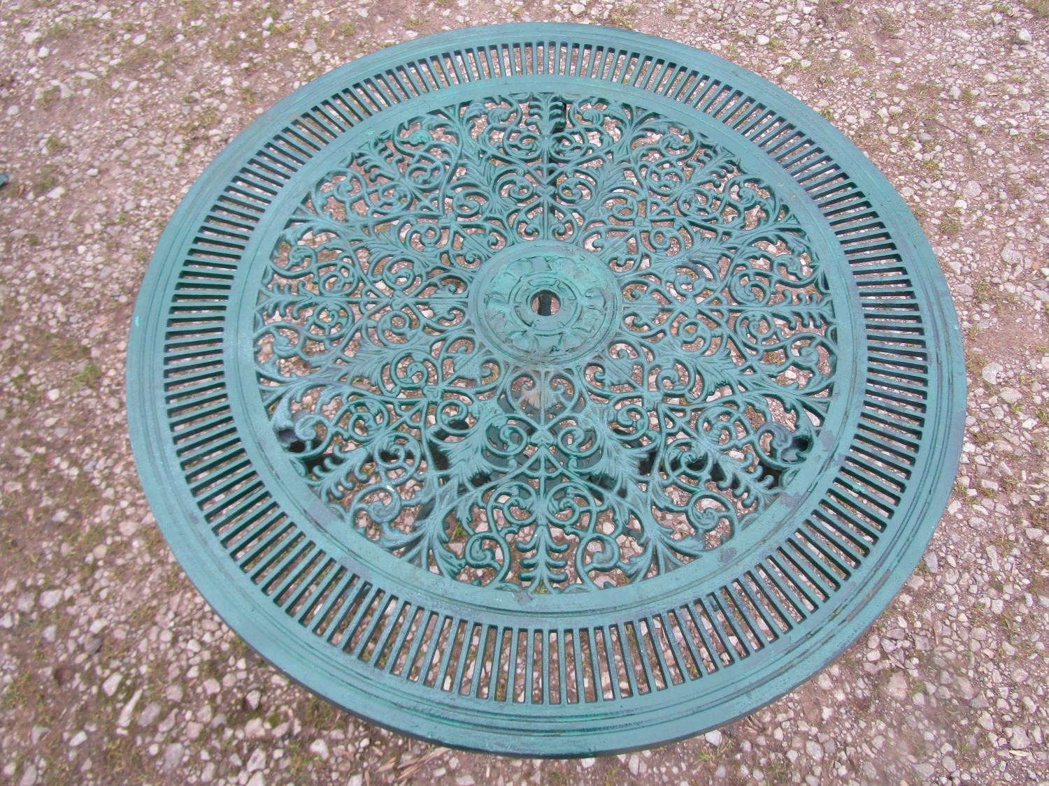 A green painted cast aluminium garden terrace table of circular form, with decorative pierced top, - Image 6 of 6