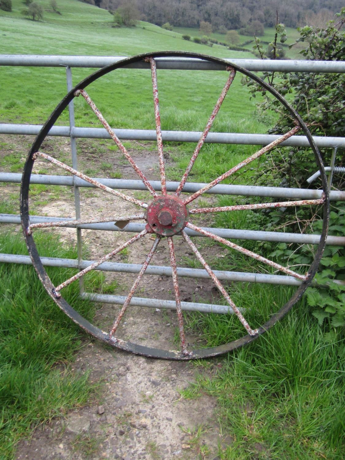 A large antique iron implement wheel with traces of layers of painted finish 122 cm (4ft diameter) - Image 3 of 3
