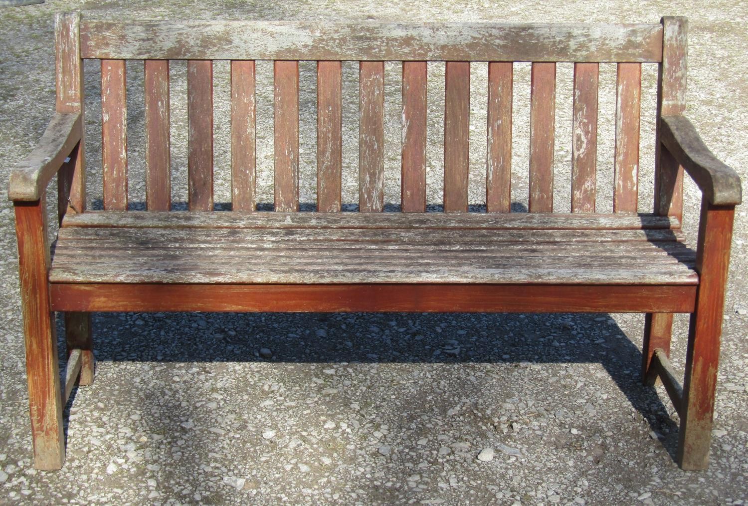 A pair of good quality heavy gauge weathered teak three seat garden benches with slatted seats and - Image 2 of 7