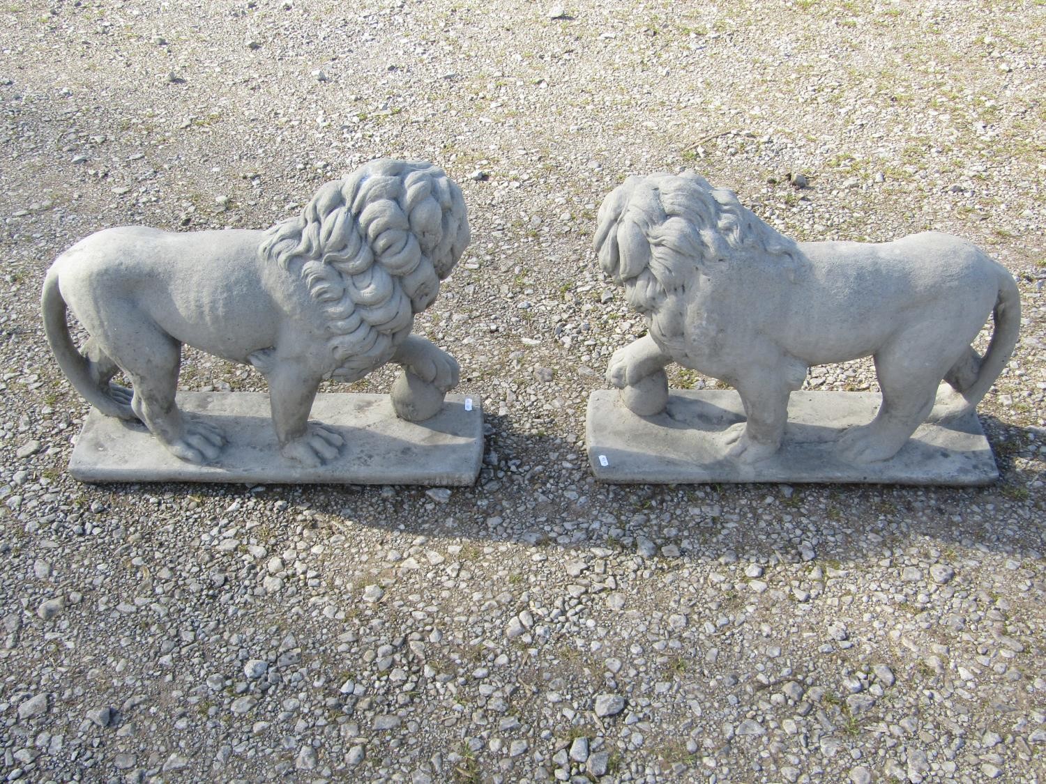 A pair of cast composition stone garden terrace/pier ornaments in the form of standing lions, 58 - Image 2 of 4