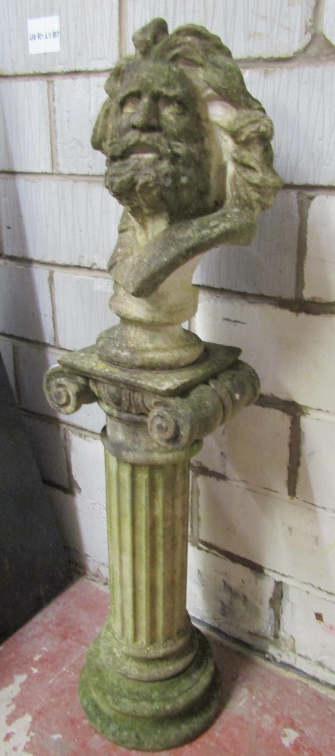 A weathered cast composition stone bust of a male character with flowing hair and beard raised on - Image 2 of 4