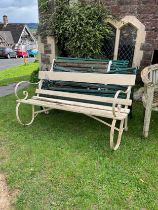 A 19th century painted and weathered garden bench, with painted wooden slats and sprung iron
