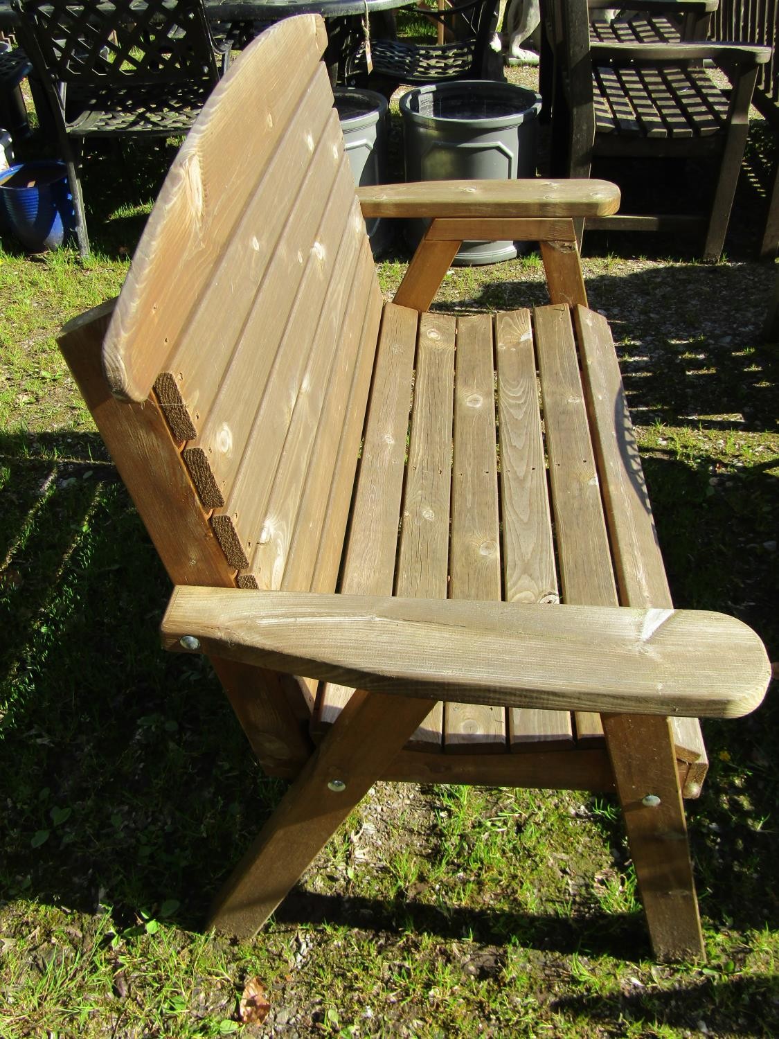A contemporary weathered softwood 2 seat garden bench with slatted seat and back raised on splayed - Image 2 of 3