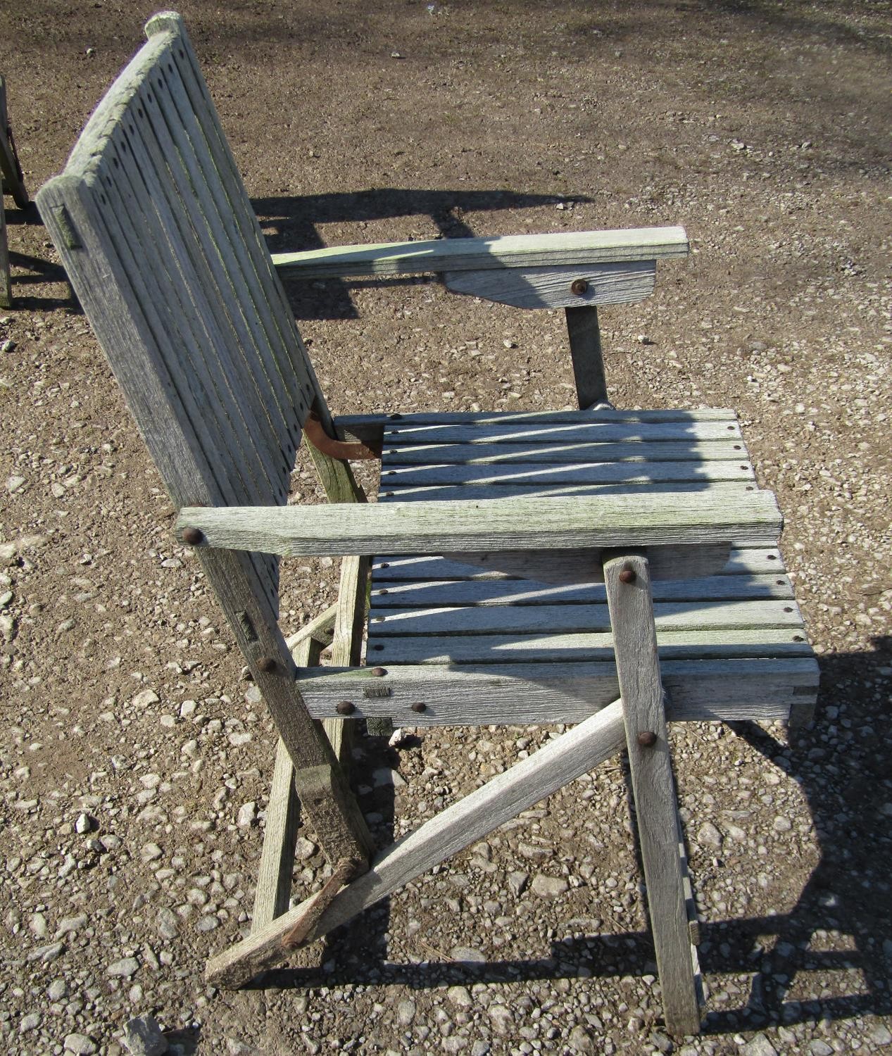 A weathered (silvered) teak garden suite comprising a folding bench with slatted seat and back 141 - Image 4 of 6