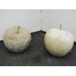 A pair of good quality weathered contemporary garden ornaments in the form of apples, 45 cm diameter