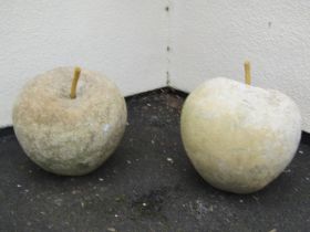 A pair of good quality weathered contemporary garden ornaments in the form of apples, 45 cm diameter