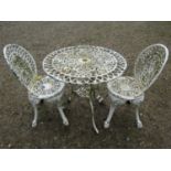 A cast alloy three piece garden terrace set comprising a circular top table and two matching