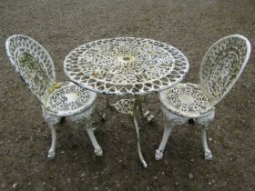 A cast alloy three piece garden terrace set comprising a circular top table and two matching