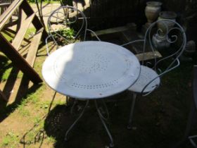 A weathered ironwork 3 piece garden terrace set with open scroll and pierced detail, Table 70cm