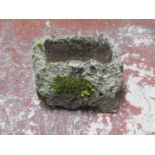 A small weathered lava type stone trough, 22cm high x 36cm x 23cm
