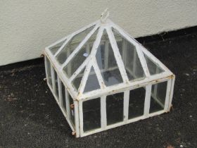 An old weathered glazed iron-framed garden closh, 45cm high, 46 x 46cm.