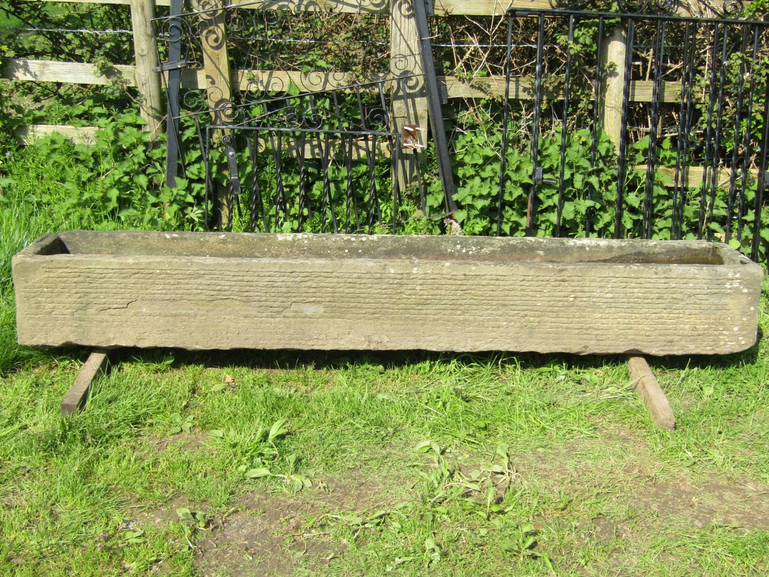 A good weathered rectangular natural stone trough with tapered interior 242 cm long x 40 cm wide x