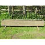 A good weathered rectangular natural stone trough with tapered interior 242 cm long x 40 cm wide x