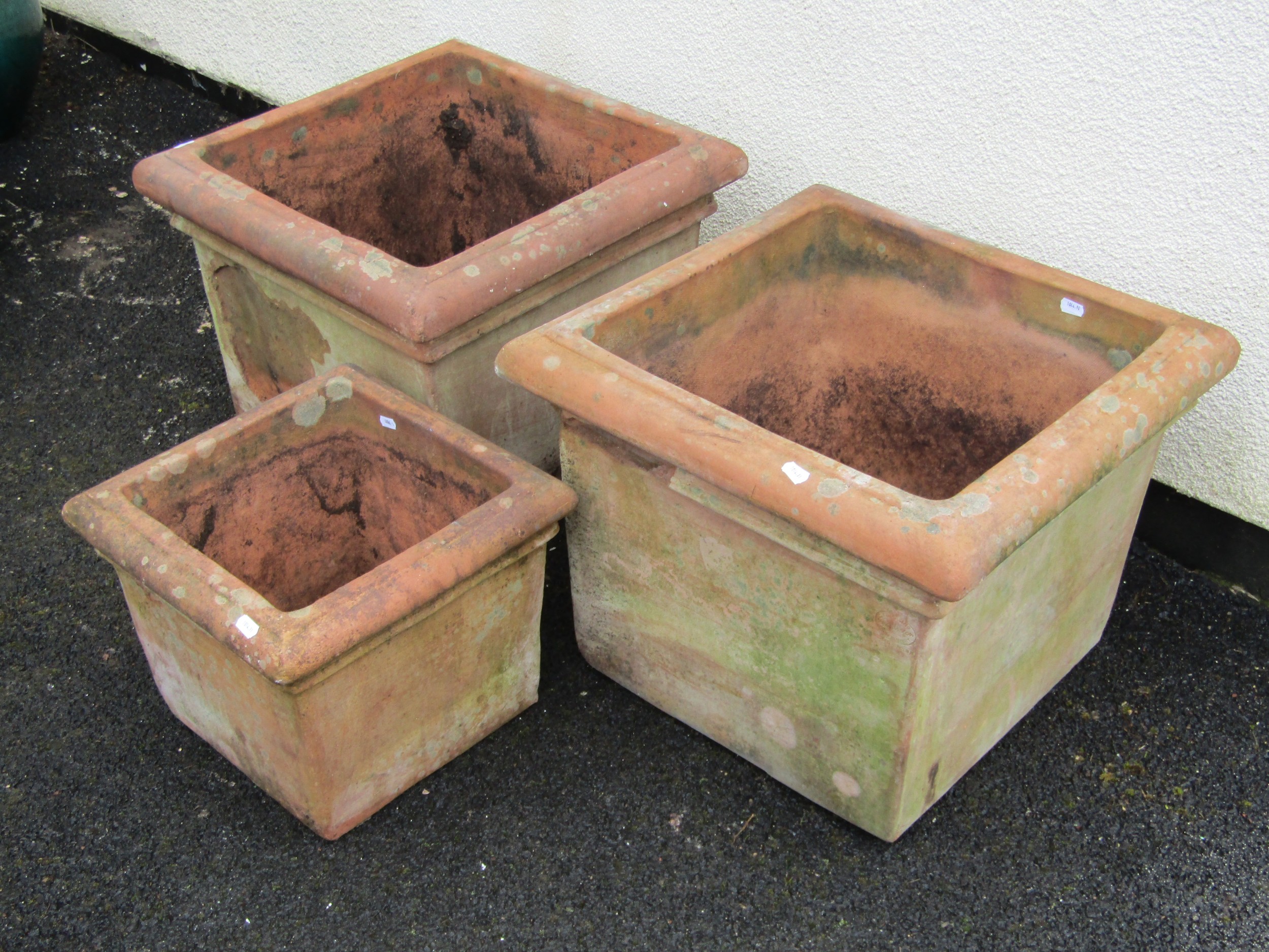 A pair of weathered terracotta planters of square cut form with moulded rims 42 cm high x 53 cm - Image 2 of 4